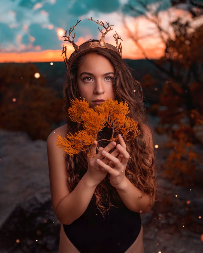 Captivating fantasy-themed portrait with an autumnal backdrop and mystical elements.